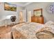 Light-filled bedroom with hardwood floors and a work space with a beautiful exterior view at 1875 Glenwood Oaks Ln, Deland, FL 32720