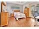 Bedroom with hardwood floors, work space, and french doors to an exterior porch at 1875 Glenwood Oaks Ln, Deland, FL 32720