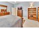 Bedroom with wood furniture, carpet floor and TV at 1875 Glenwood Oaks Ln, Deland, FL 32720