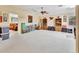Spacious bonus room with a large carpeted area and views into the connected bedroom at 1875 Glenwood Oaks Ln, Deland, FL 32720