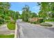 Gated community entrance with brick signage and landscaping at 1875 Glenwood Oaks Ln, Deland, FL 32720