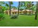 Well-maintained one-story home with lush lawn, mature trees, and beautiful landscaping at 1875 Glenwood Oaks Ln, Deland, FL 32720