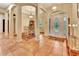 Welcoming foyer boasts tile floors, columns, and a decorative front door with glass detailing at 1875 Glenwood Oaks Ln, Deland, FL 32720