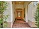 Inviting front entrance featuring a beautiful wood door with glass detailing and tiled flooring at 1875 Glenwood Oaks Ln, Deland, FL 32720