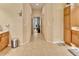 Hallway with neutral paint and tile flooring. View of office at the end of the hall at 1875 Glenwood Oaks Ln, Deland, FL 32720