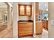 Hallway nook with wooden drawers and cabinets adjacent to gourmet kitchen at 1875 Glenwood Oaks Ln, Deland, FL 32720