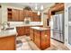 Modern kitchen with stainless steel appliances, custom cabinetry, and center island at 1875 Glenwood Oaks Ln, Deland, FL 32720