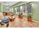 Comfortable living area with wet bar, TV, and tile flooring, ideal for entertaining or relaxing at 1875 Glenwood Oaks Ln, Deland, FL 32720