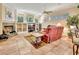 Comfortable living room with neutral tones, fireplace, and built-in shelving at 1875 Glenwood Oaks Ln, Deland, FL 32720