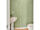 Charming powder room with pedestal sink and toilet, offering convenience for guests at 1875 Glenwood Oaks Ln, Deland, FL 32720