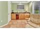 Entertainment space with a wet bar that has wood cabinetry and a wine fridge at 1875 Glenwood Oaks Ln, Deland, FL 32720