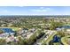 An aerial perspective of a residential area with meticulously landscaped yards and multiple water features at 2015 Cornell Pl, Port Orange, FL 32128