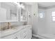 Bathroom featuring a double sink vanity, marble countertop, and decorative tile flooring at 2015 Cornell Pl, Port Orange, FL 32128