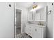 Bathroom featuring a double sink vanity, marble countertop, and decorative tile flooring at 2015 Cornell Pl, Port Orange, FL 32128
