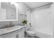 Bathroom featuring marble vanity top, and tub with tile surround at 2015 Cornell Pl, Port Orange, FL 32128