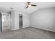 Bedroom with plush carpeting, neutral walls, and a convenient walk-in closet at 2015 Cornell Pl, Port Orange, FL 32128