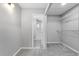 Walk-in closet with ample shelving and stylish tile flooring at the entrance at 2015 Cornell Pl, Port Orange, FL 32128