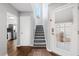 Inviting entryway with staircase, light gray walls, and modern decor at 2015 Cornell Pl, Port Orange, FL 32128