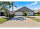 Charming townhome featuring a two-car garage, and mature landscaping at 2015 Cornell Pl, Port Orange, FL 32128