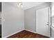 Hallway features hardwood flooring and a white door at 2015 Cornell Pl, Port Orange, FL 32128