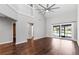 Expansive living room featuring wood floors, soaring ceilings, and staircase at 2015 Cornell Pl, Port Orange, FL 32128