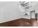 Large living room featuring wood floors, and views of the kitchen area at 2015 Cornell Pl, Port Orange, FL 32128