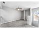 Loft area with carpet, a ceiling fan, and a large window at 2015 Cornell Pl, Port Orange, FL 32128