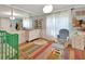 This Bedroom features a crib, a rocking chair and a rainbow rug, creating a comforting atmosphere at 238 Crooked Tree Trl, Deland, FL 32724