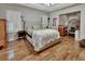 Main bedroom boasts wood floors, ensuite and great natural light from the shuttered windows at 238 Crooked Tree Trl, Deland, FL 32724