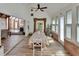 Open dining room with vaulted ceiling, hardwood floors, and natural light at 238 Crooked Tree Trl, Deland, FL 32724