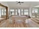 Bright dining room with large mirror, wood floors, and exposed brick detail at 238 Crooked Tree Trl, Deland, FL 32724