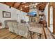 Bright living room boasts high ceilings, a stone fireplace, and wood floors at 238 Crooked Tree Trl, Deland, FL 32724