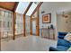Sitting room bathed in natural light with tile floors, unique decor, and wooden beams at 238 Crooked Tree Trl, Deland, FL 32724