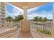 Beautiful covered balcony with views of palm trees and surrounding area at 2515 S Atlantic Ave # 401, Daytona Beach Shores, FL 32118