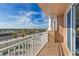 Enjoy city views from this tiled balcony with white railing and structural column on a sunny day at 2515 S Atlantic Ave # 401, Daytona Beach Shores, FL 32118