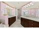Bathroom featuring dual sinks, walk-in shower and lots of lighting at 2515 S Atlantic Ave # 401, Daytona Beach Shores, FL 32118