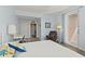 Calming bedroom with a balcony, accentuated with soft blue walls and stylish decor at 2515 S Atlantic Ave # 401, Daytona Beach Shores, FL 32118