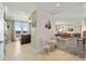 Hallway leading into the living and dining areas, and a balcony with seating at 2515 S Atlantic Ave # 401, Daytona Beach Shores, FL 32118