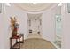 Inviting hallway featuring tiled floors, neutral paint, and an ornate rug creating a warm and welcoming space at 2515 S Atlantic Ave # 401, Daytona Beach Shores, FL 32118