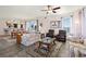 Bright and spacious living area with open floorplan to dining room and balcony access at 2515 S Atlantic Ave # 401, Daytona Beach Shores, FL 32118