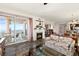 Open-concept living room with fireplace and balcony access combines comfort and elegance at 2515 S Atlantic Ave # 401, Daytona Beach Shores, FL 32118