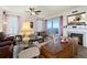 Cozy living room featuring a fireplace, comfortable seating, and scenic ocean view at 2515 S Atlantic Ave # 401, Daytona Beach Shores, FL 32118