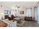 Comfortable living room boasts neutral colors, a large window, and a welcoming atmosphere at 2515 S Atlantic Ave # 401, Daytona Beach Shores, FL 32118
