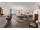 Bright living room and dining area with balcony and large windows at 2515 S Atlantic Ave # 401, Daytona Beach Shores, FL 32118