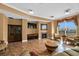 Elegant living room with a fireplace and beautiful ocean views from the balcony at 2515 S Atlantic Ave # 401, Daytona Beach Shores, FL 32118