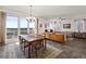 Inviting living and dining area with balcony access and city views at 2515 S Atlantic Ave # 401, Daytona Beach Shores, FL 32118
