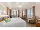 Bright main bedroom featuring balcony access, sitting area, and scenic ocean view at 2515 S Atlantic Ave # 401, Daytona Beach Shores, FL 32118