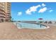 Sparkling outdoor pool with sun loungers and ocean views for the ultimate relaxation experience at 2515 S Atlantic Ave # 401, Daytona Beach Shores, FL 32118