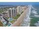 Aerial view of oceanfront condos, beaches, pools and parking at 2555 S Atlantic Ave # 1007, Daytona Beach Shores, FL 32118