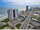 Aerial view of condo buildings, ocean, parking, and beach access at 2555 S Atlantic Ave # 1007, Daytona Beach Shores, FL 32118